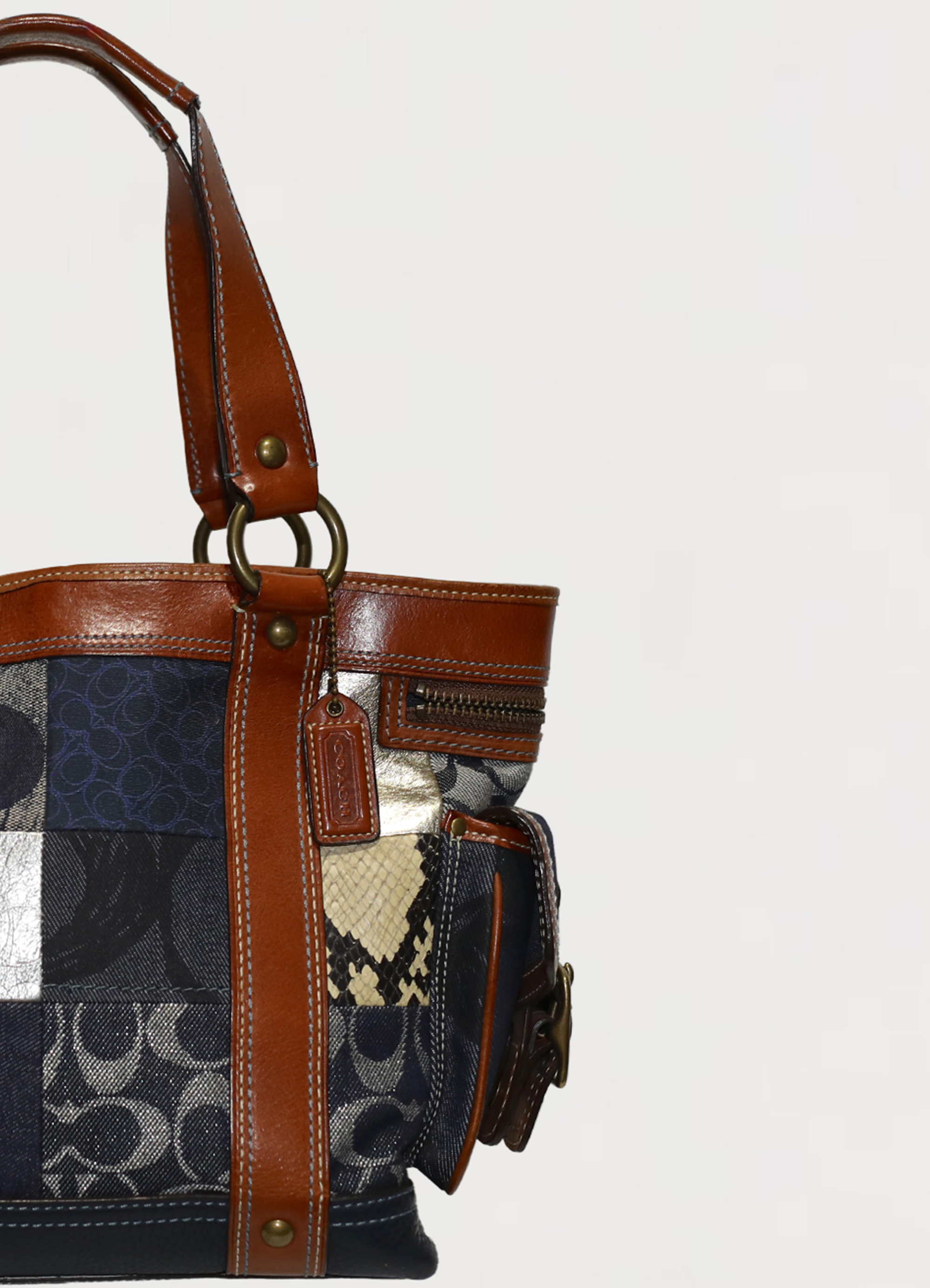 Vintage Coach Legacy denim tote bag in blue signature canvas with leather trim showing close up of hang tag