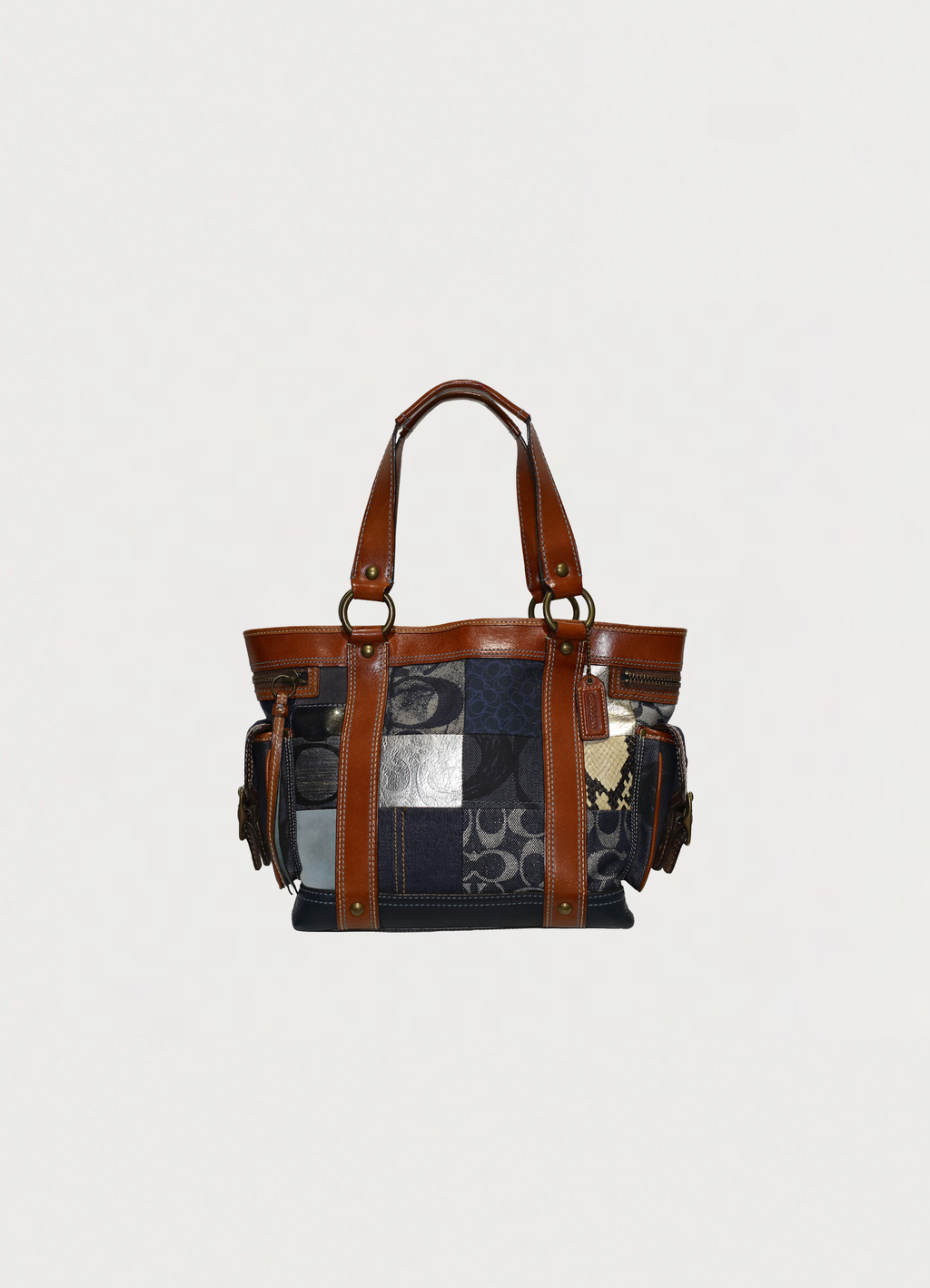 Vintage Coach Legacy denim tote bag in blue signature canvas with leather trim showing front section