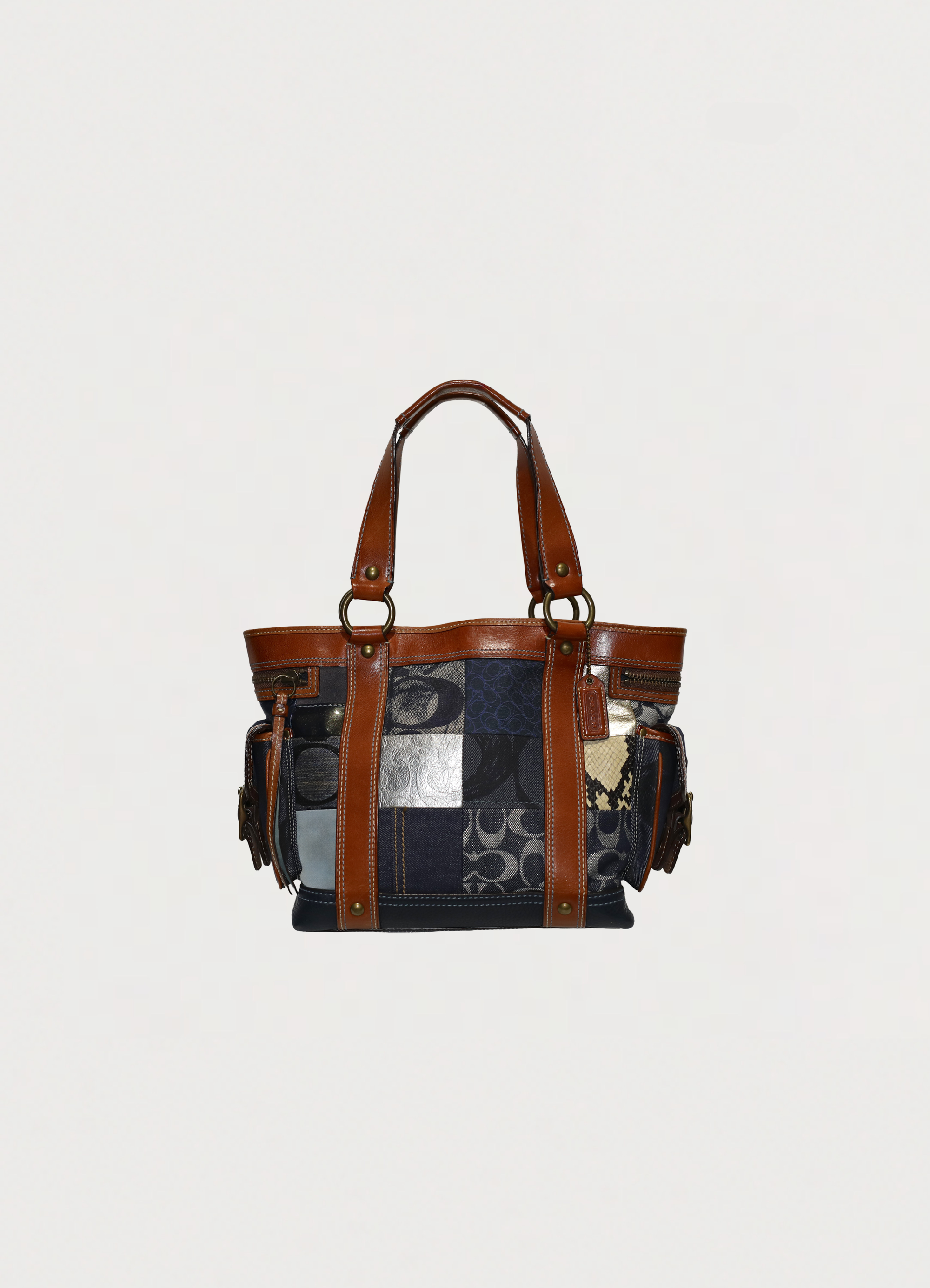Vintage Coach Legacy denim tote bag in blue signature canvas with leather trim showing front section