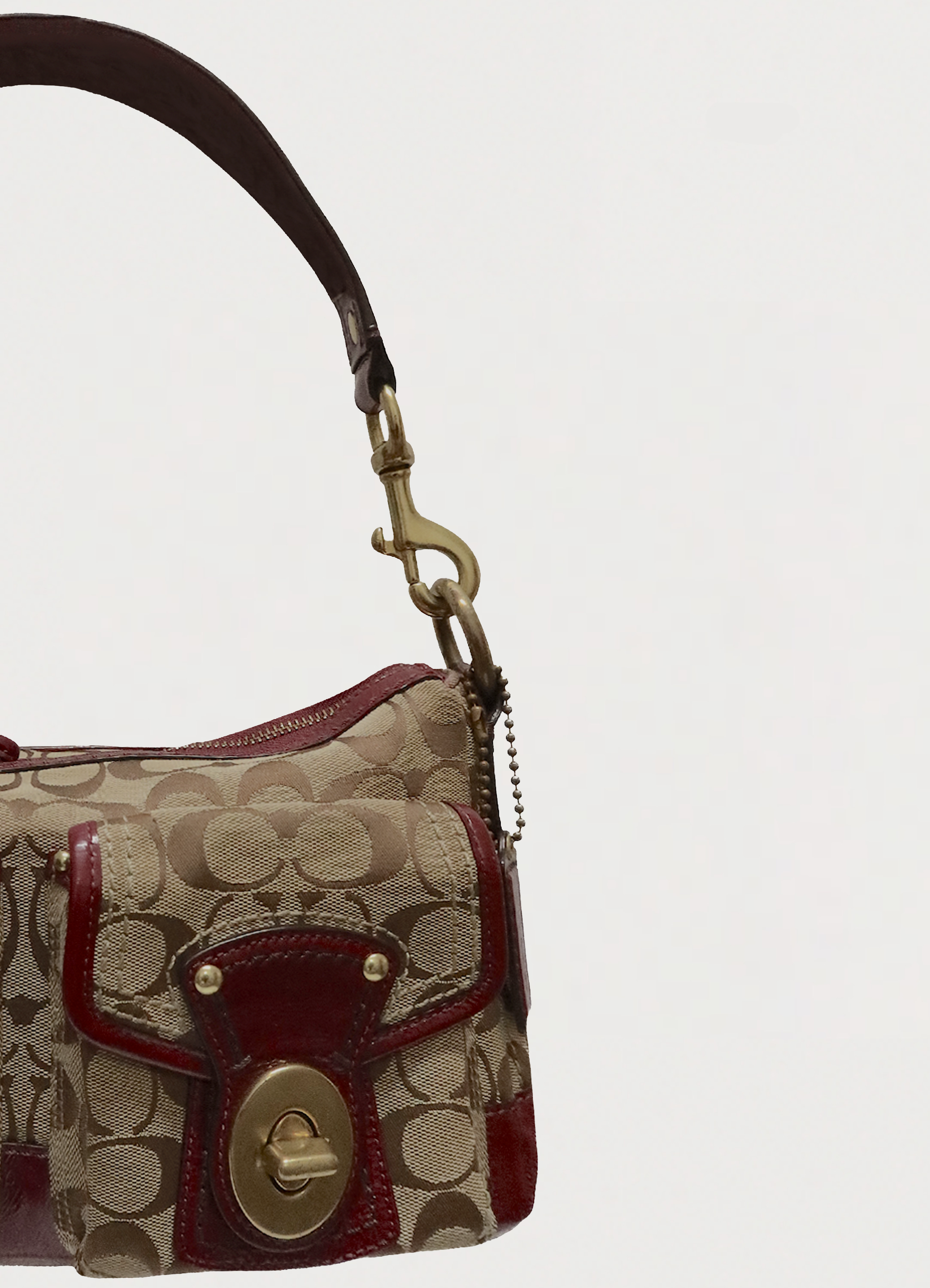 Close up of beet red leather trim and khaki signature canvas corner