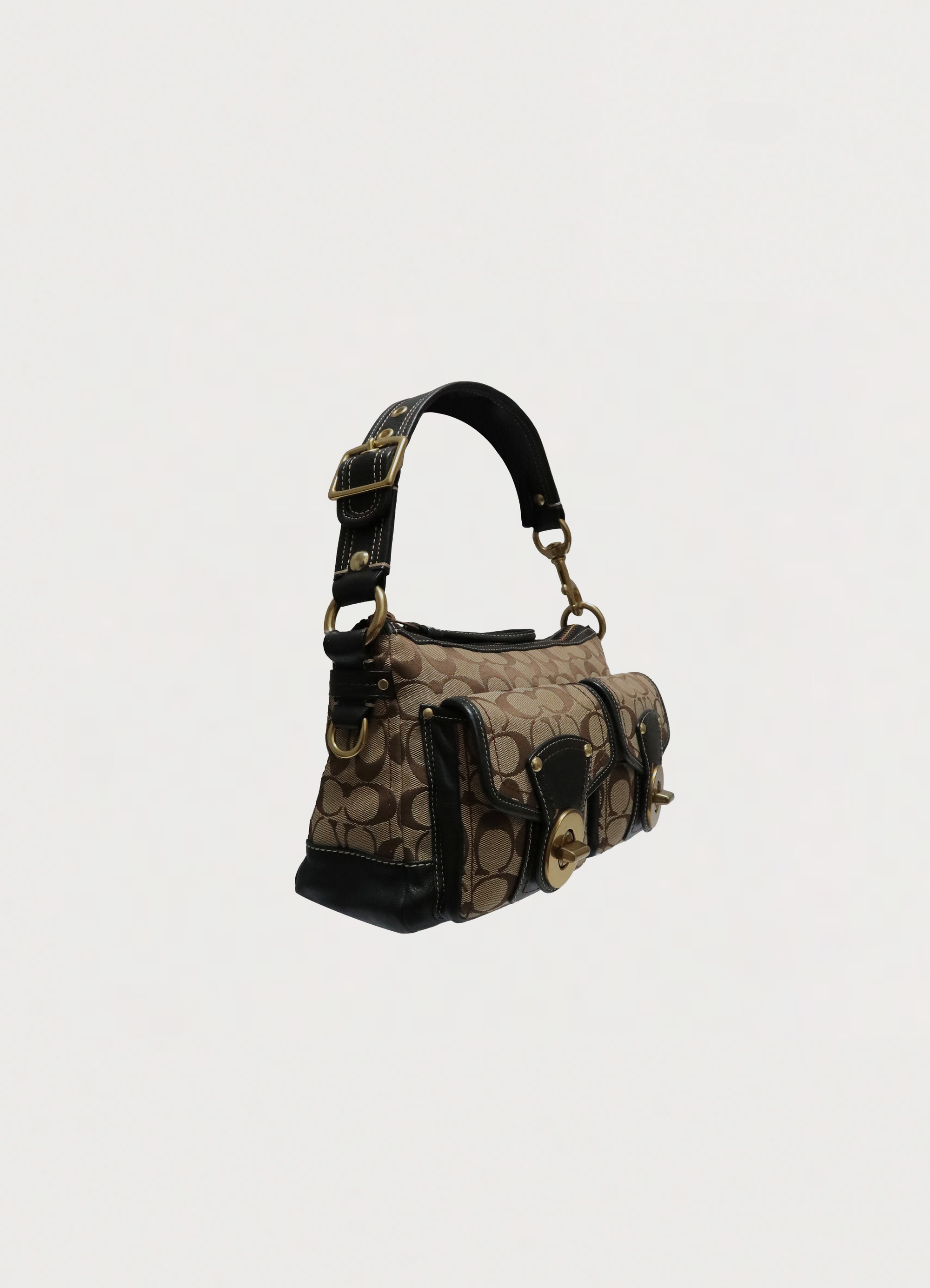 Angled view of Coach Legacy turnlock satchel showing bag depth and silhouette