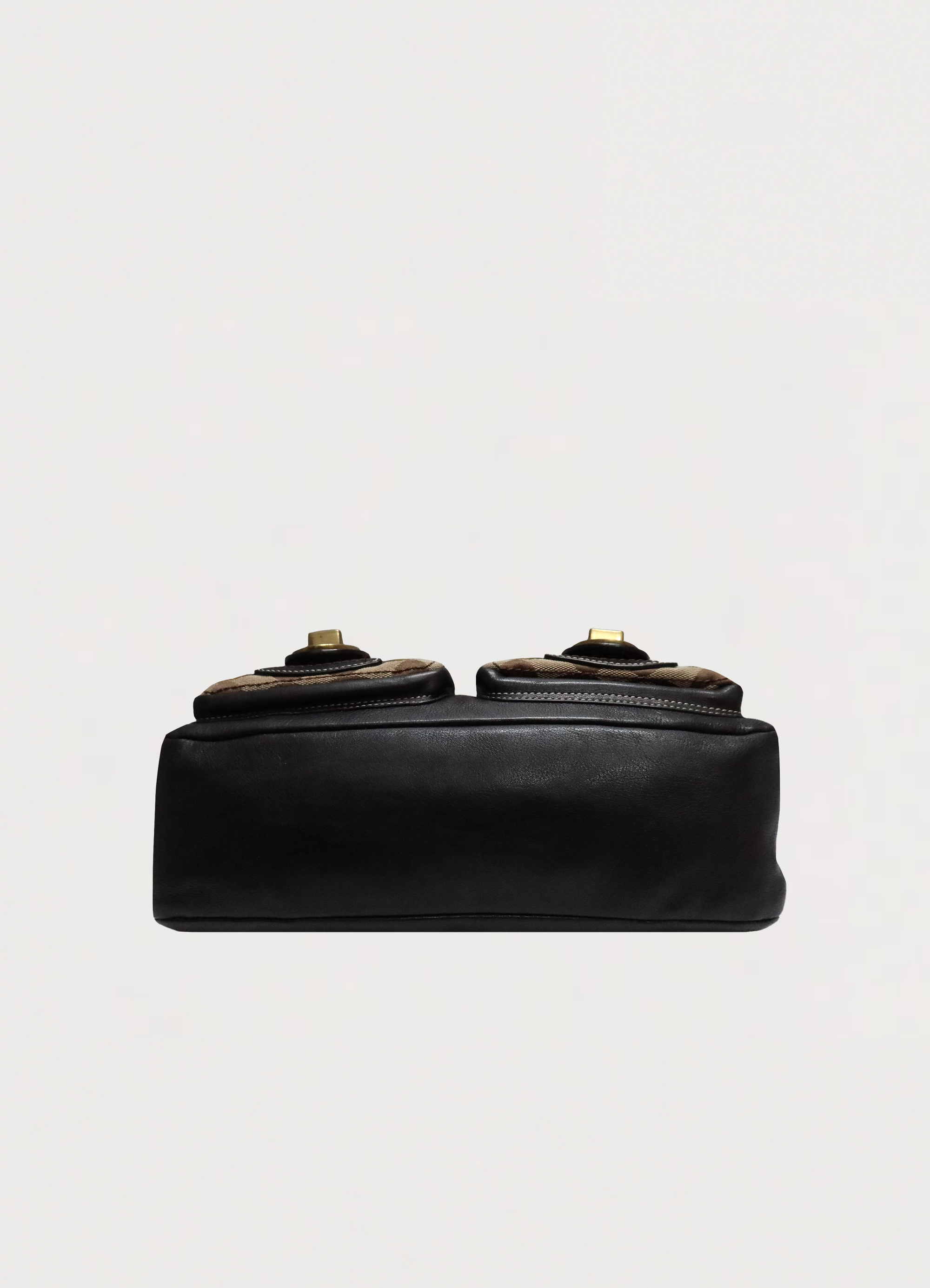 Base view of Coach Legacy satchel showing ebony leather bottom and structure
