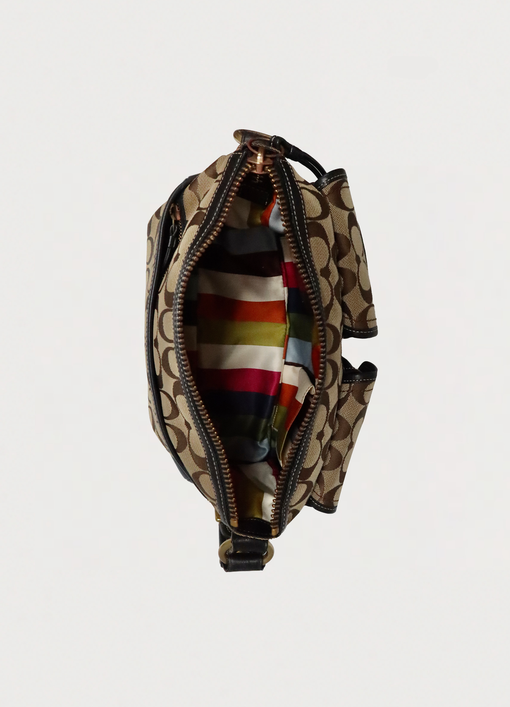 Top view of Coach Legacy satchel showing multi-color Legacy stripe silk lining