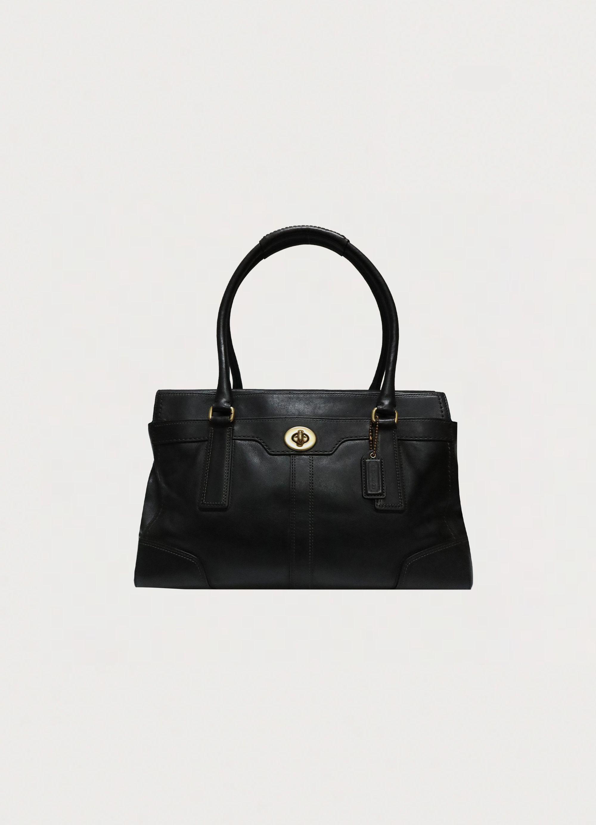 Vintage Coach Madeline turnlock satchel in black smooth leather front view