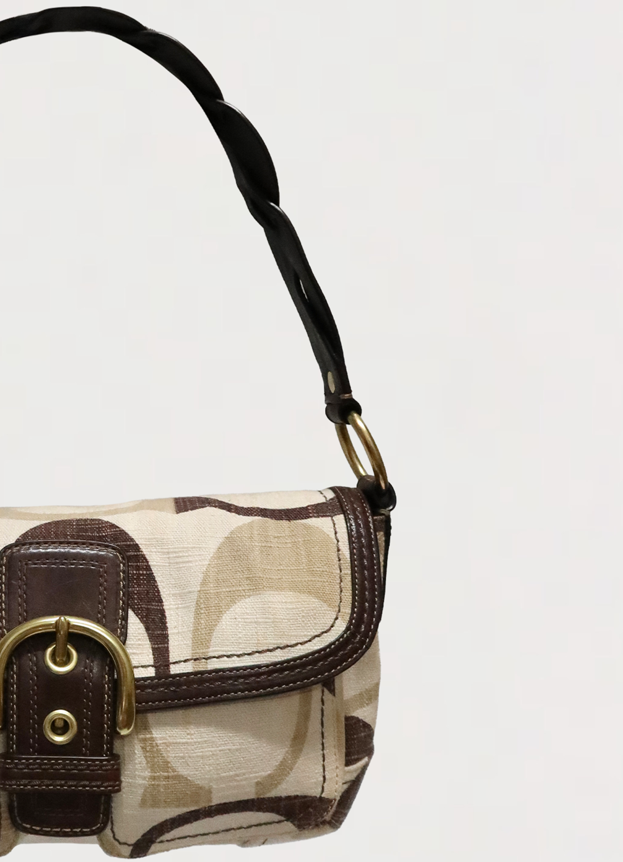 Detailed shot of mocha brown leather trim and khaki Optic signature canvas