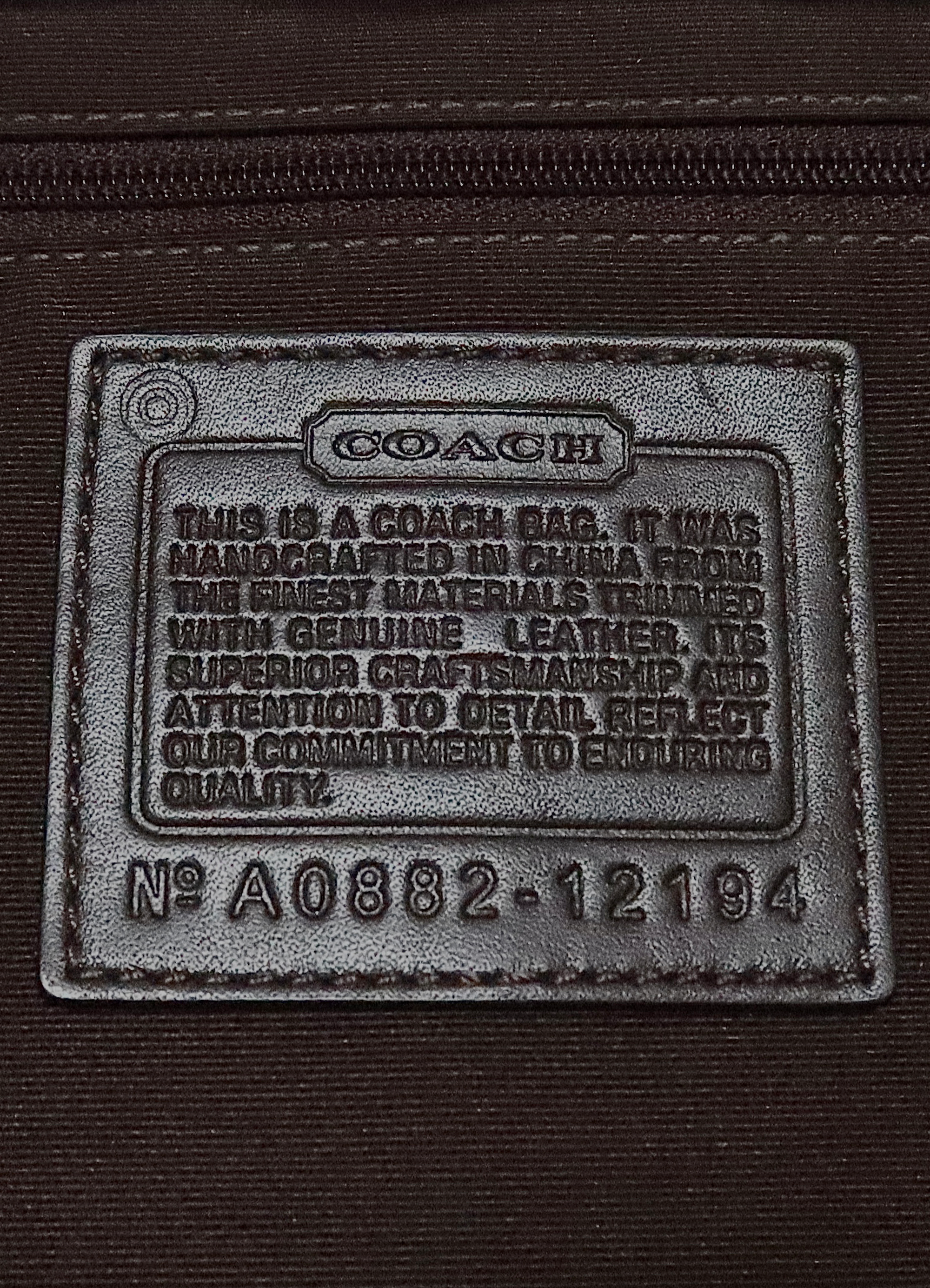 Interior leather Coach creed patch showing style number for authenticity