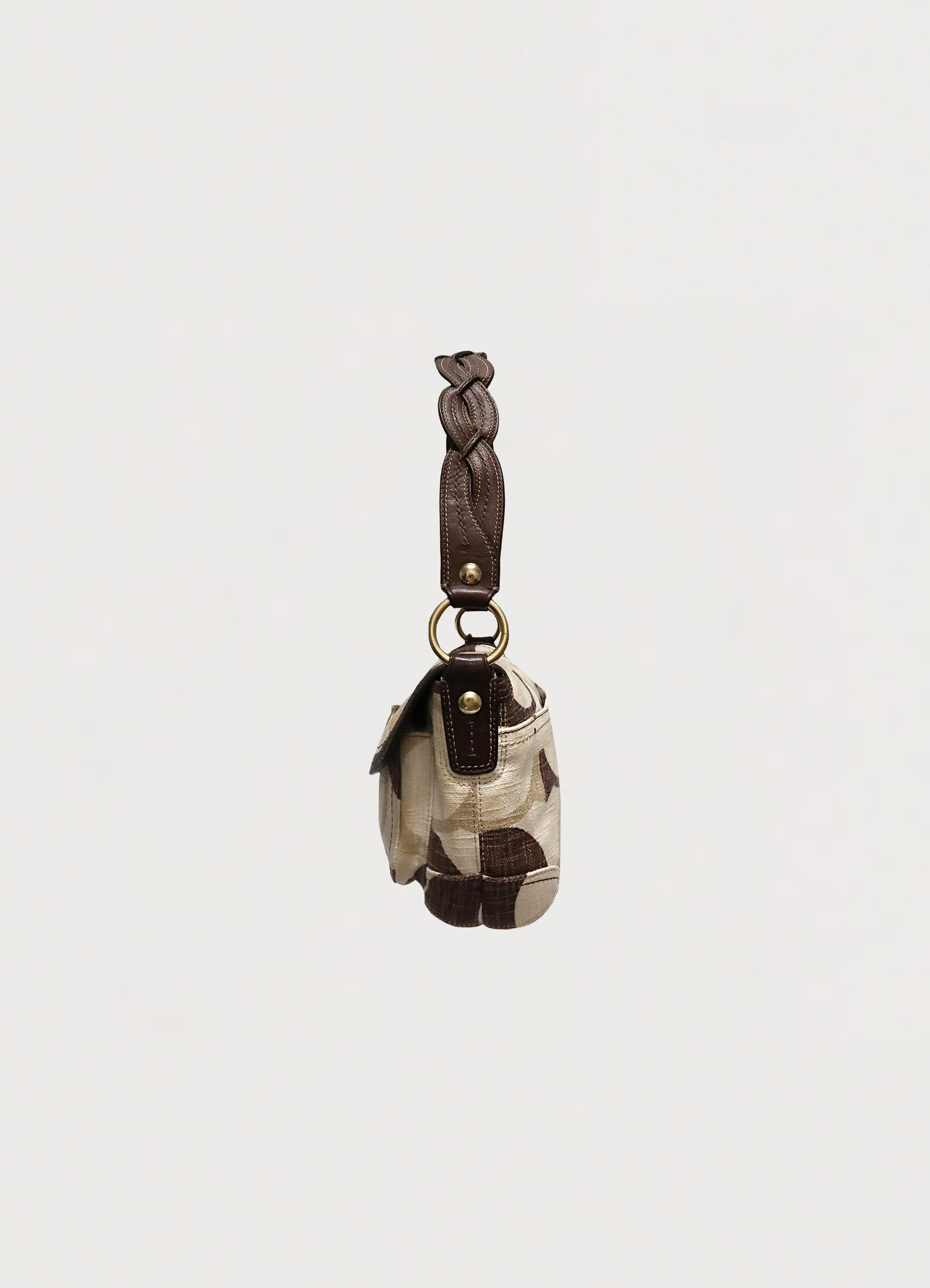Left side profile of khaki Coach Optic Signature Soho flap bag