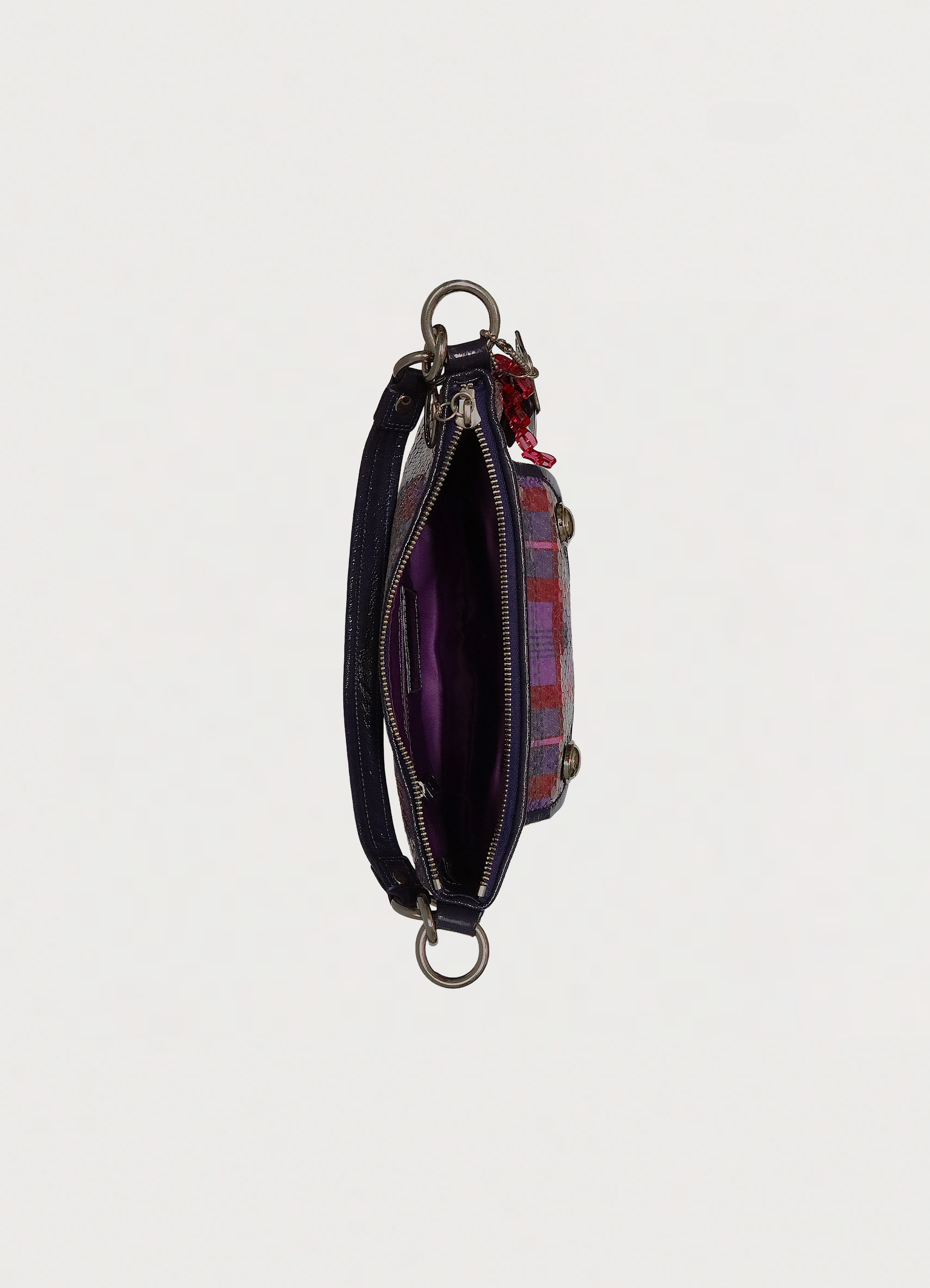 Top view of Coach Poppy bag showing purple sateen interior and zipper