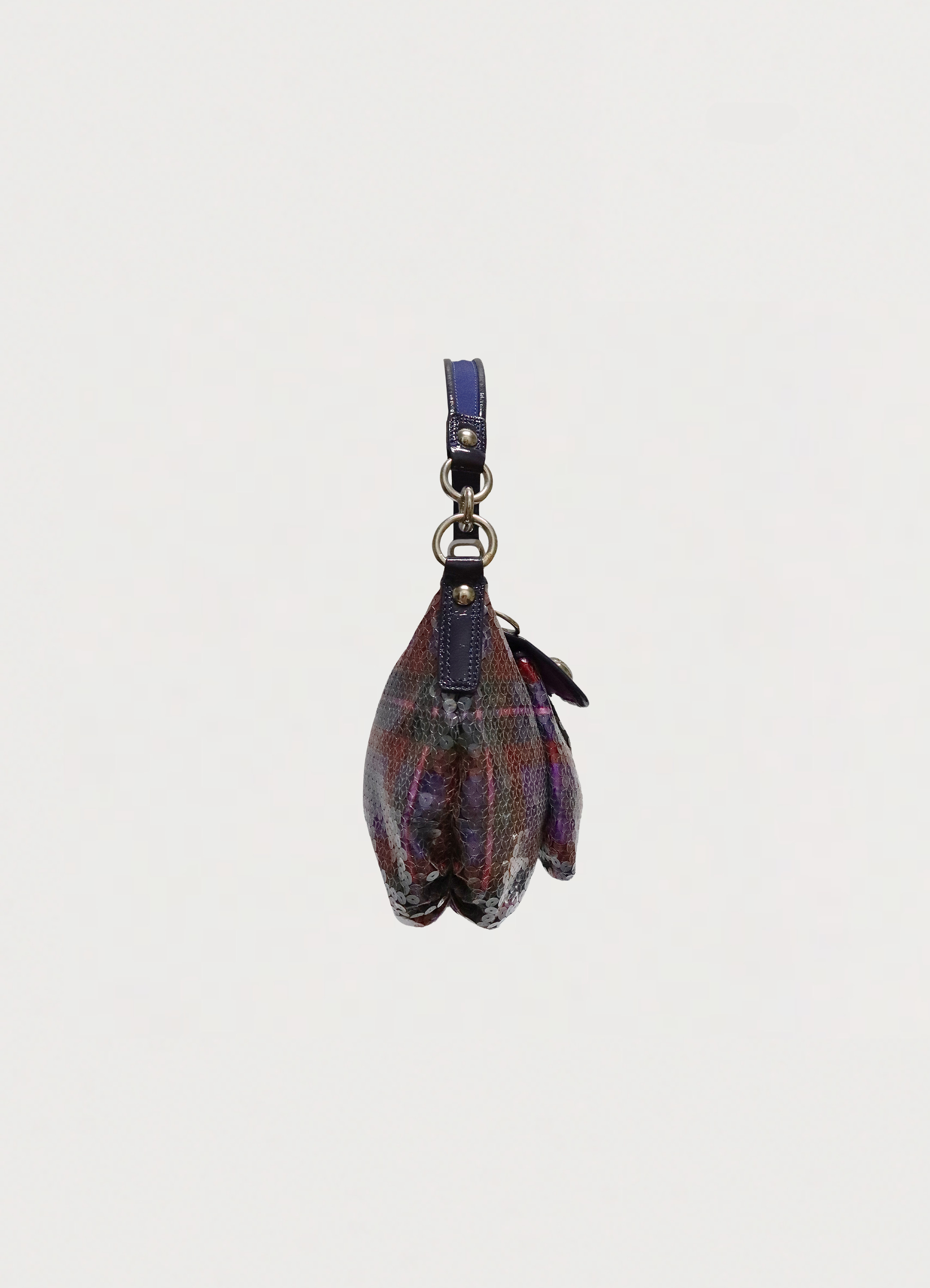 Left side profile of purple Coach Poppy Groovy sequin plaid bag