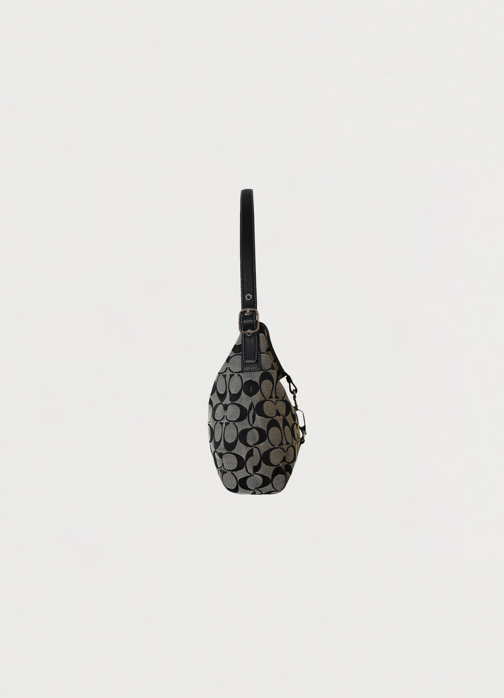 Right side profile of black and grey Coach Signature clip hobo bag