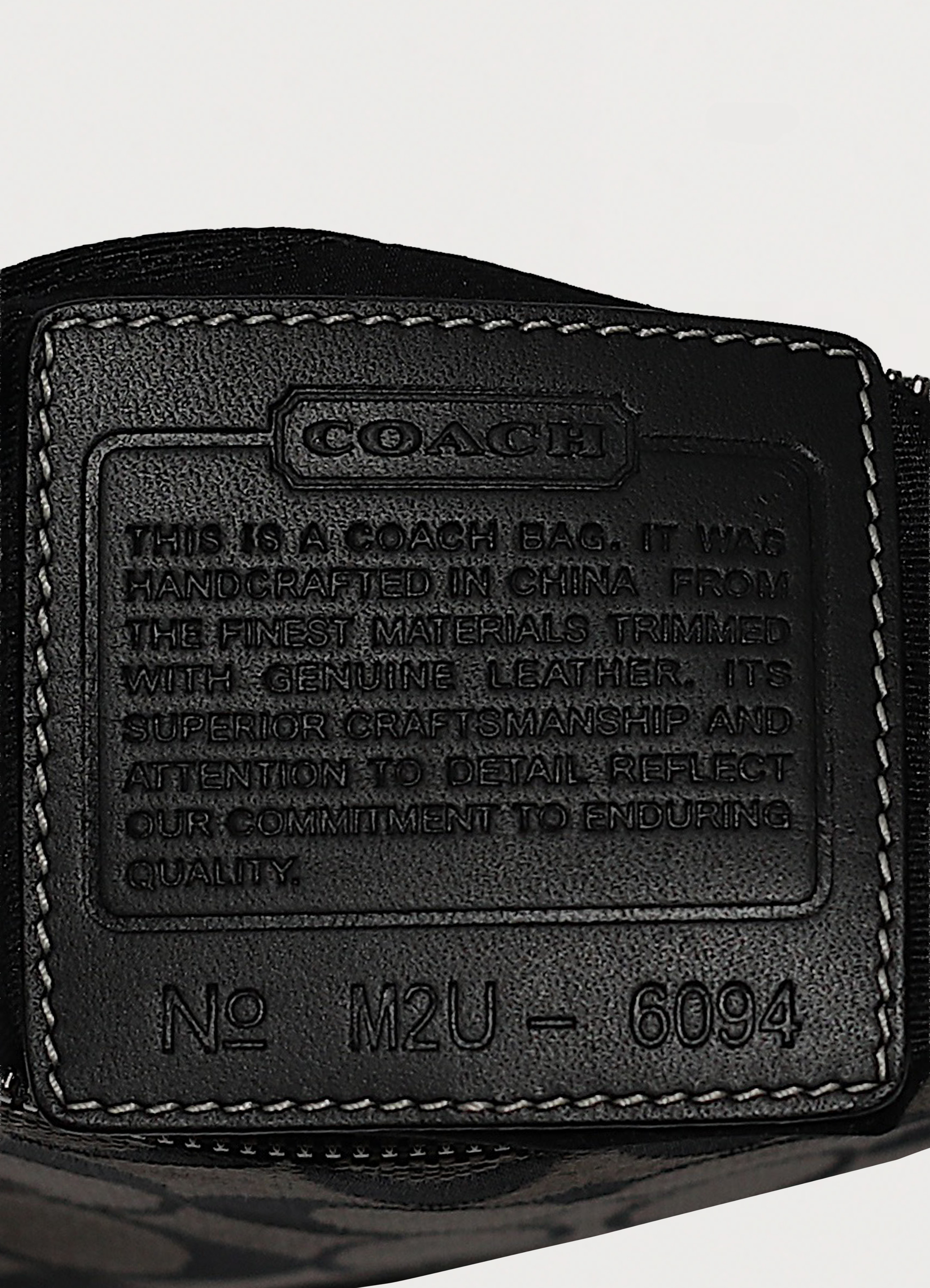 Interior leather Coach creed patch with style number for authenticity