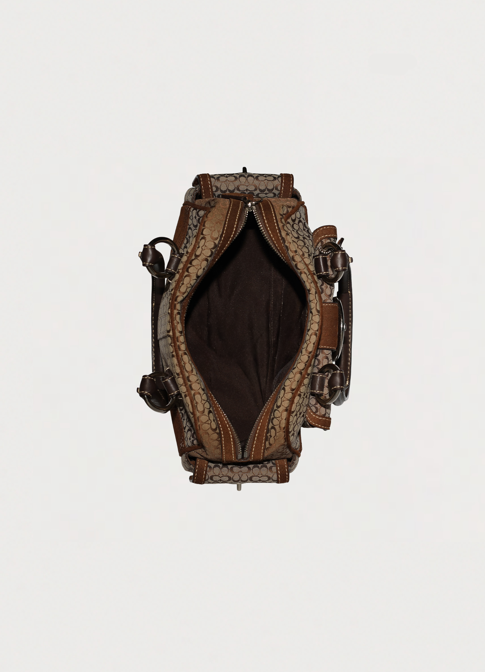 Vintage Coach Soho buckle satchel in brown signature canvas with leather trim top view interior showing