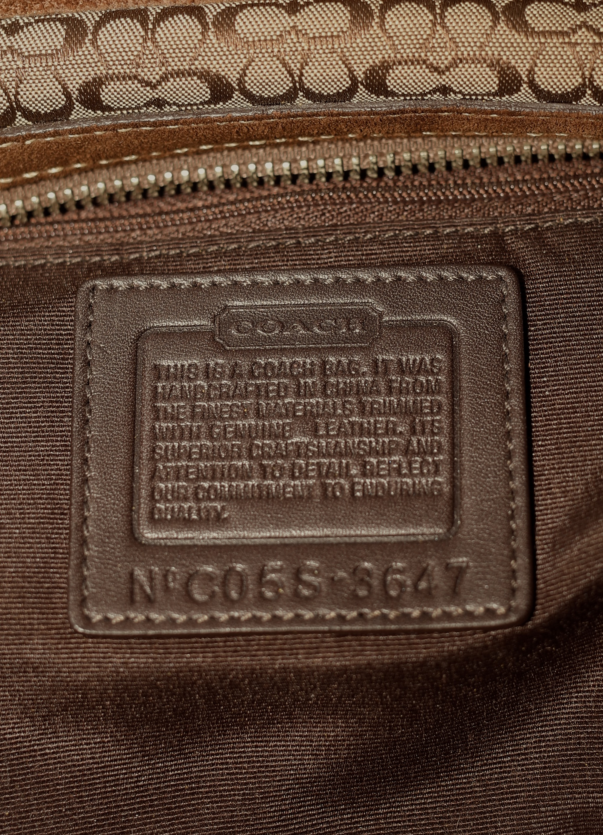 Vintage Coach Soho buckle satchel in brown signature canvas with leather trim showing creed patch