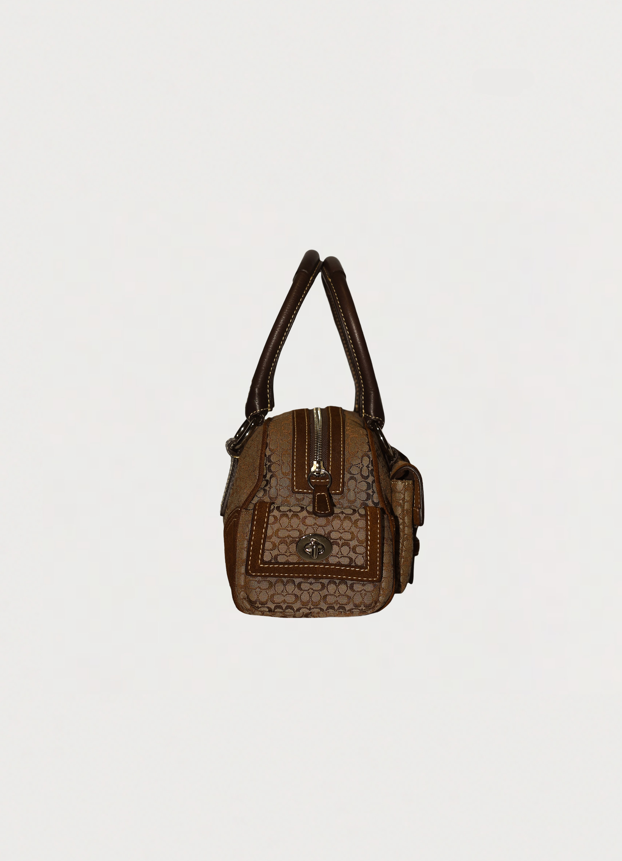 Vintage Coach Soho buckle satchel in brown signature canvas with leather trim left side