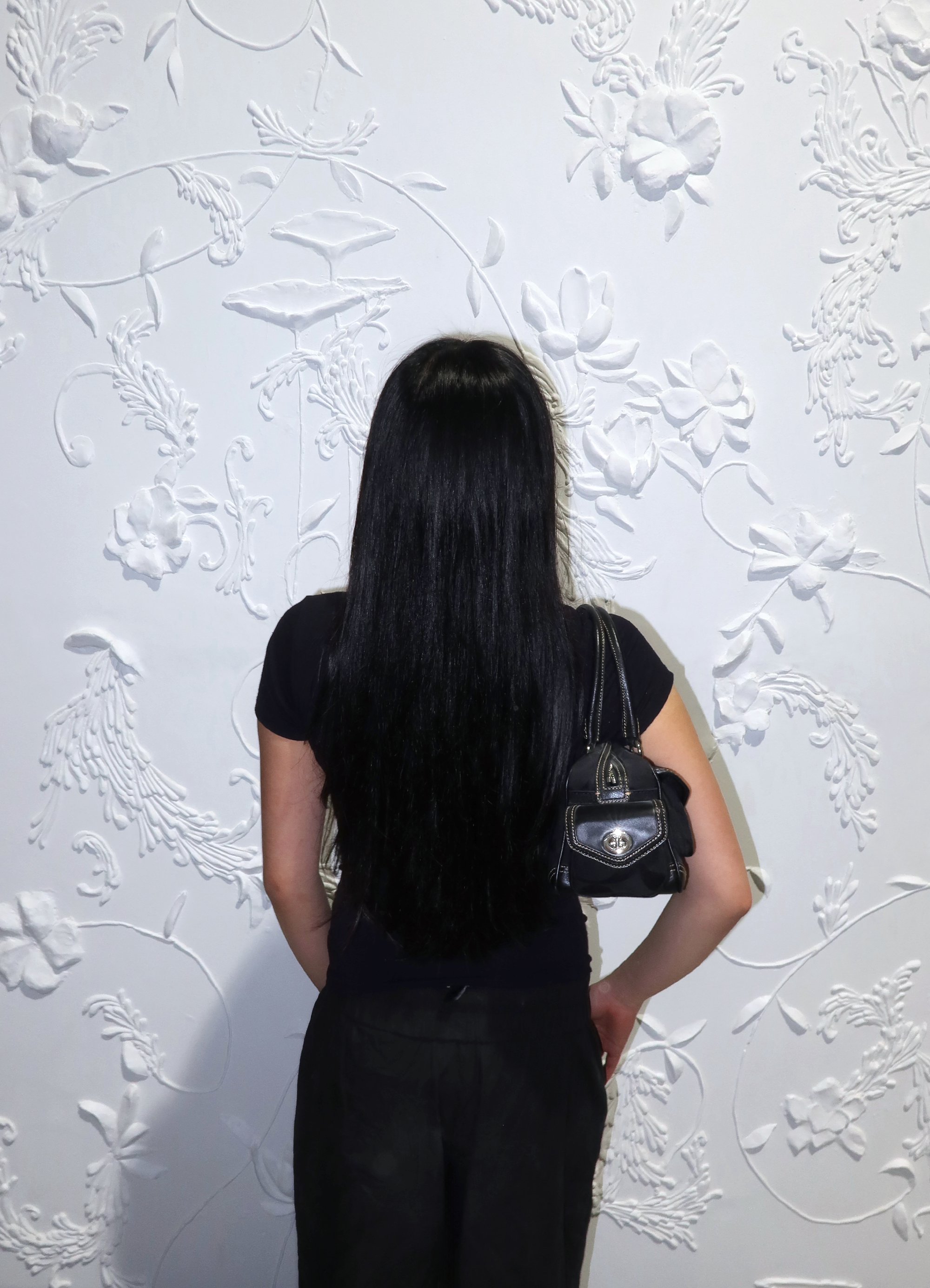 Black Coach Soho Gallery satchel worn on shoulder by model