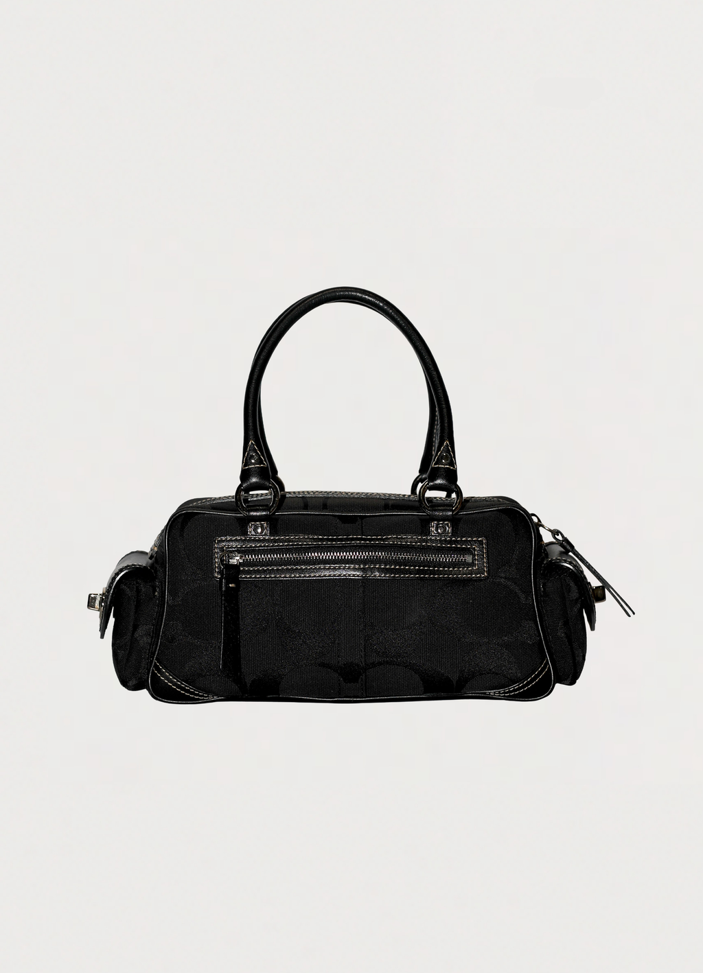 Vintage Coach Soho gallery satchel in black signature canvas with leather trim showing back view