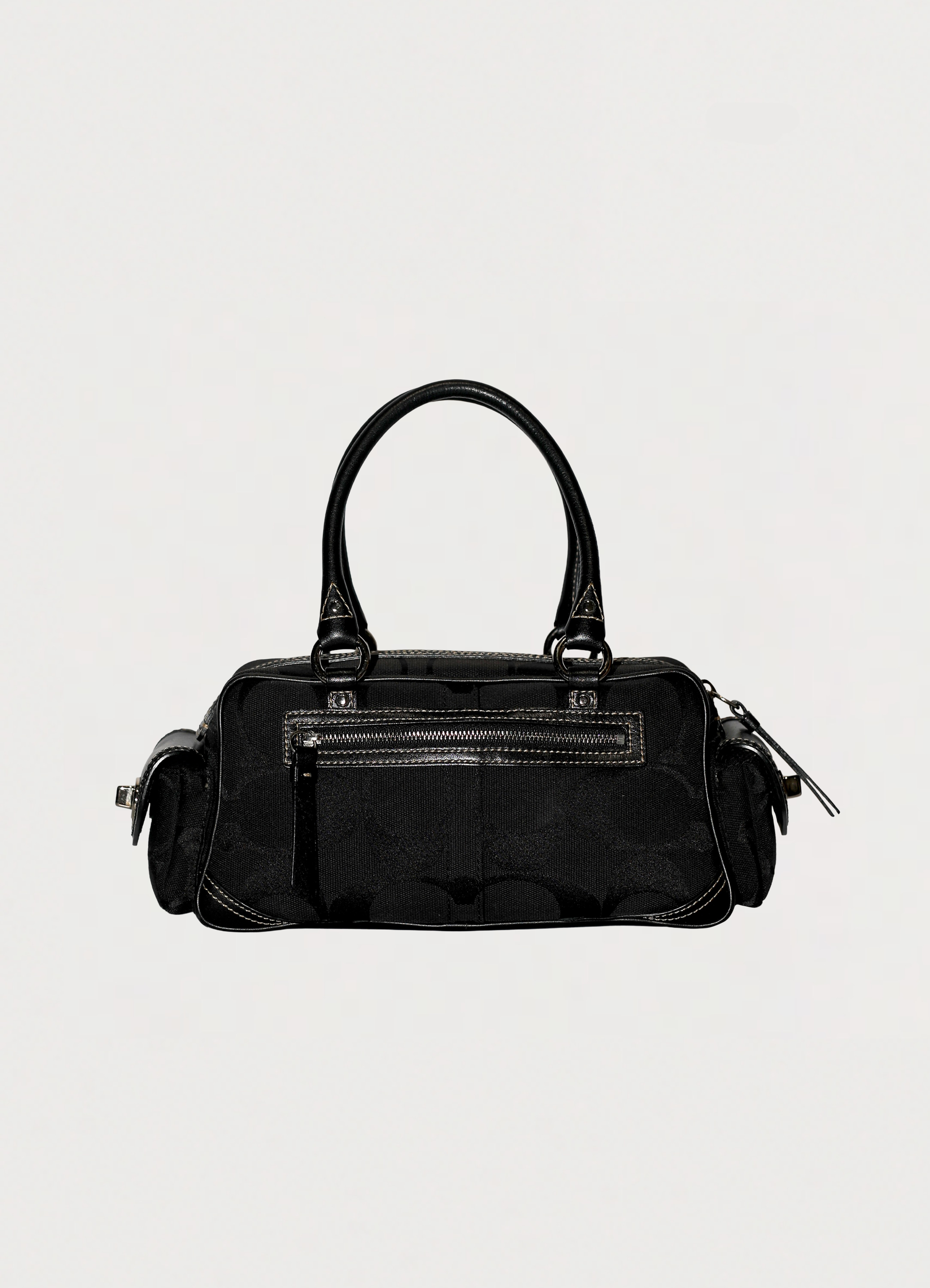 Vintage Coach Soho gallery satchel in black signature canvas with leather trim showing back view