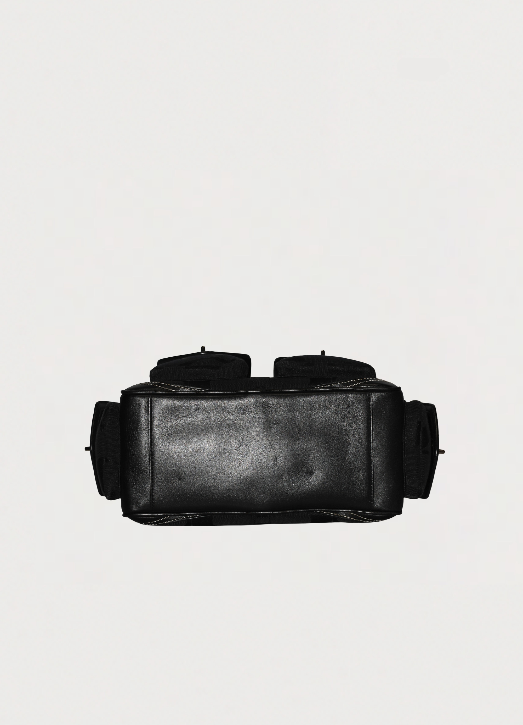 Vintage Coach Soho gallery satchel in black signature canvas with leather trim showing base section
