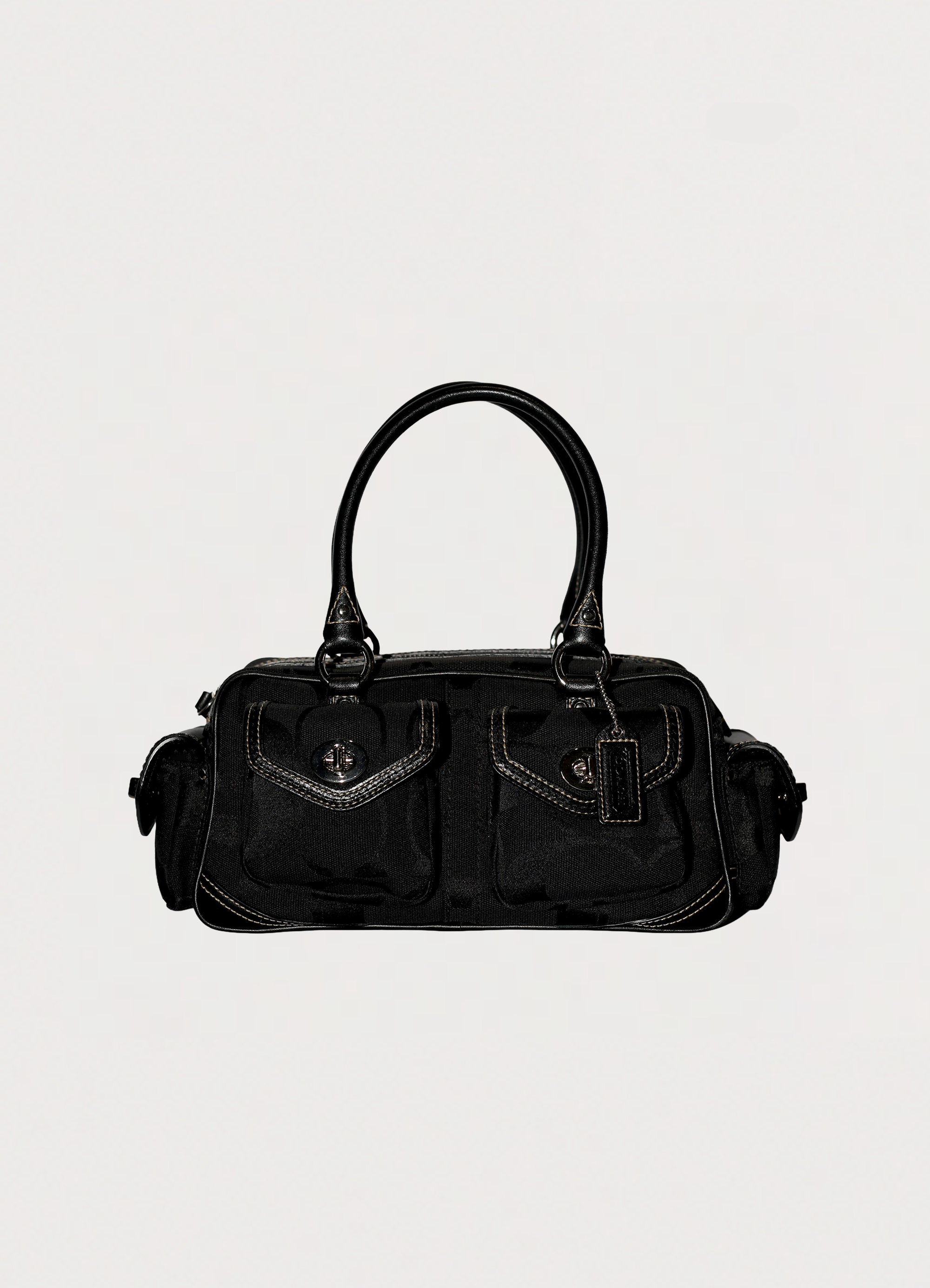 Vintage Coach Soho gallery satchel in black signature canvas with leather trim showing front
