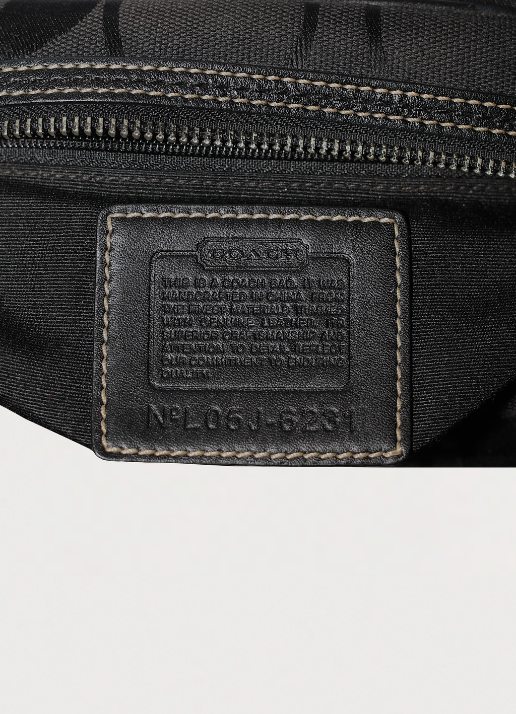 Vintage Coach Soho gallery satchel in black signature canvas with leather trim showing creed patch