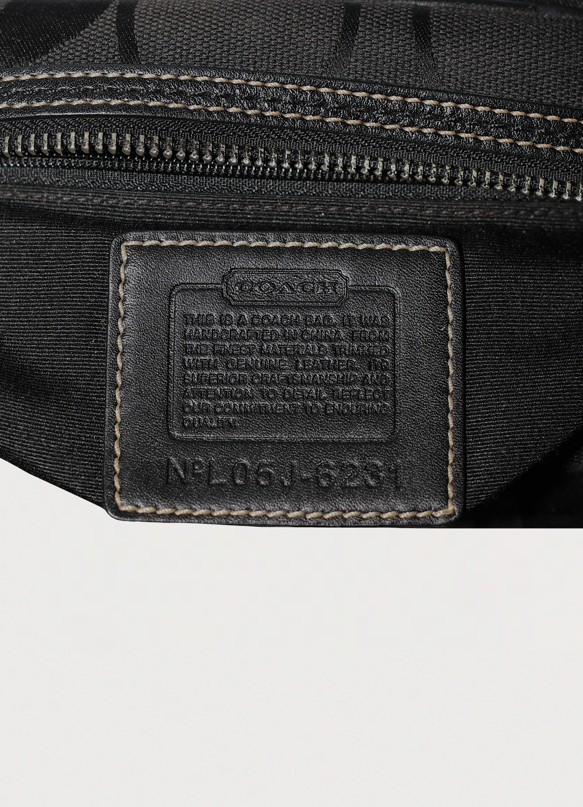 Vintage Coach Soho gallery satchel in black signature canvas with leather trim showing creed patch