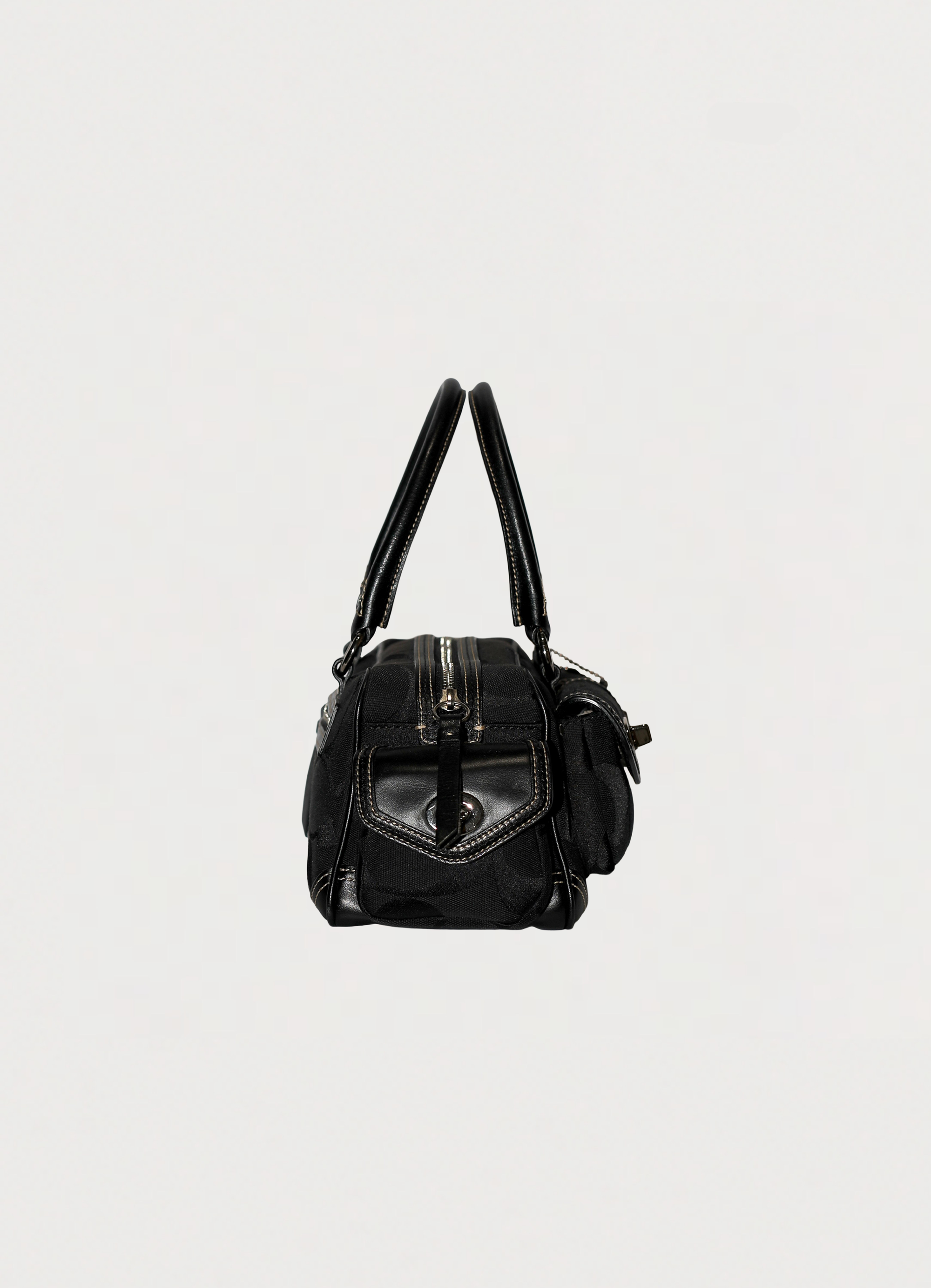 Vintage Coach Soho gallery satchel in black signature canvas with leather trim showing right side