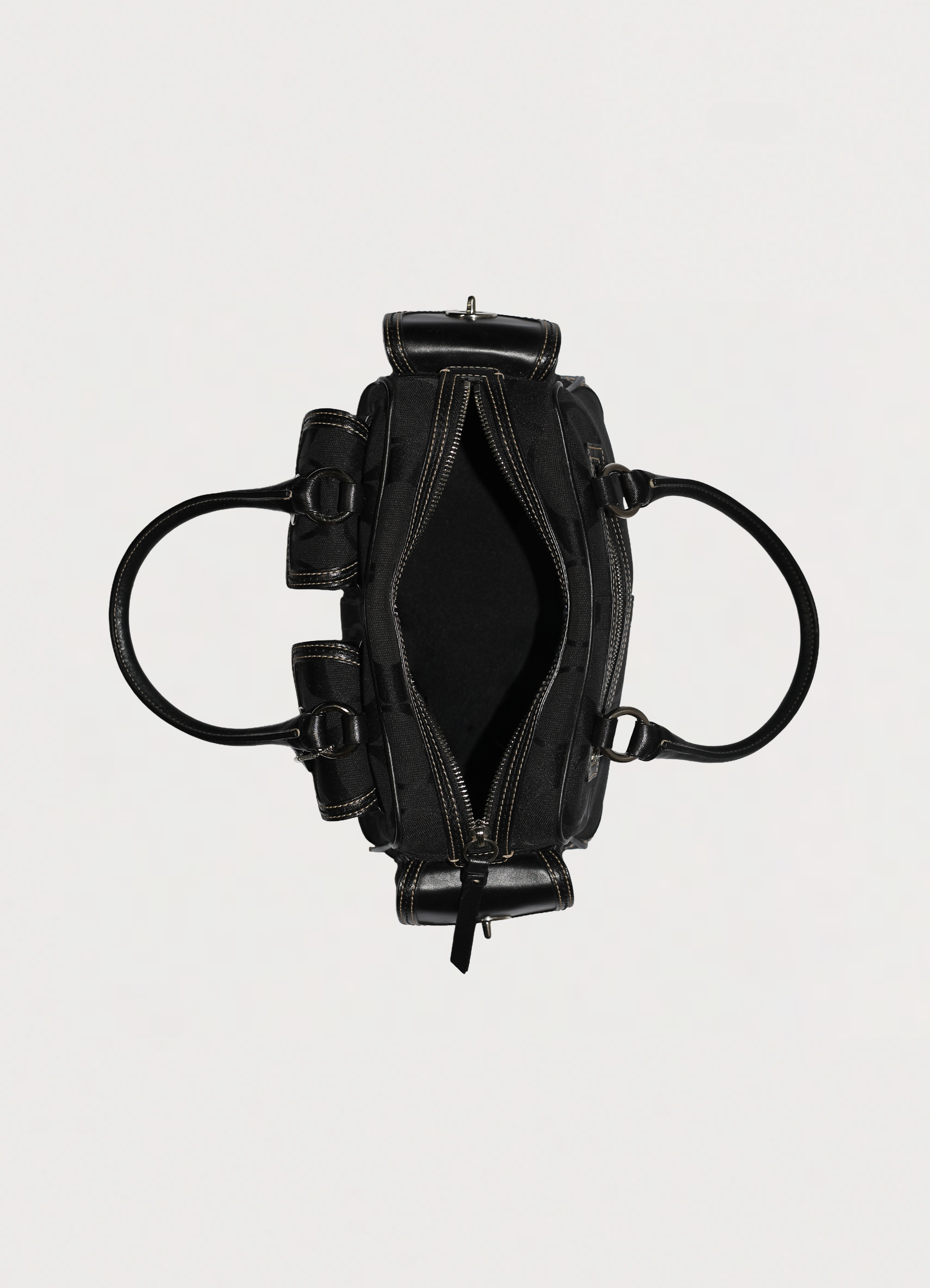 Vintage Coach Soho gallery satchel in black signature canvas with leather trim top side showing interior side