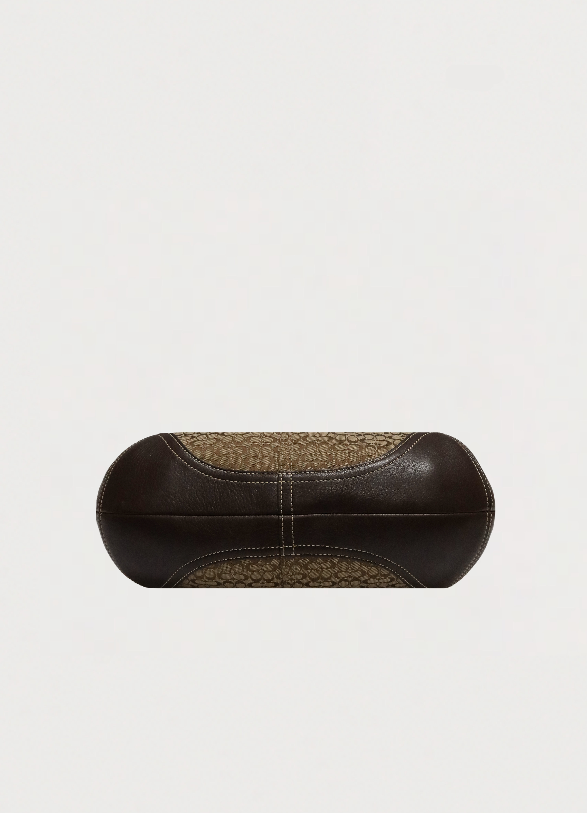 Base view of Coach Soho hobo showing brown leather bottom