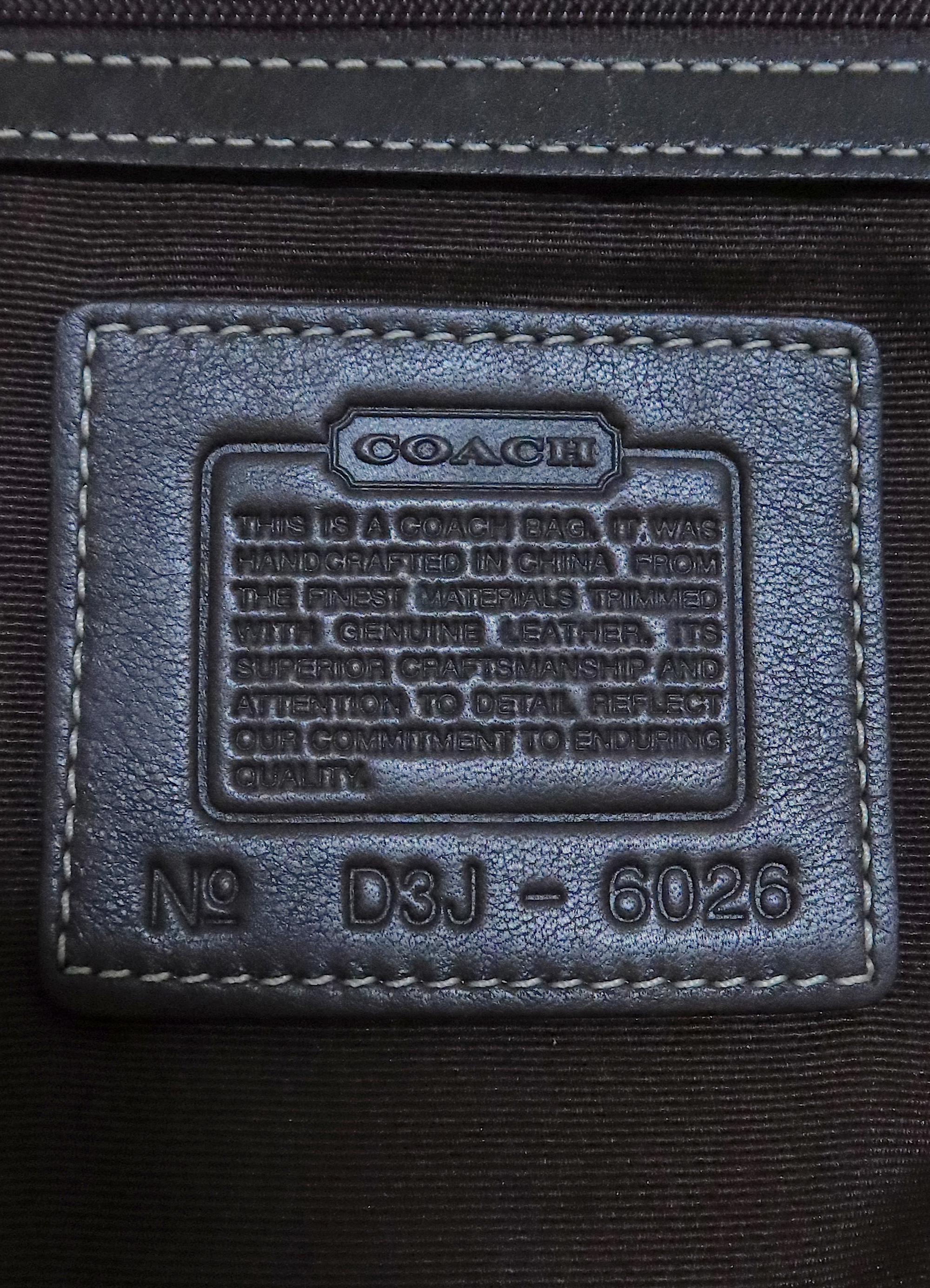 Interior leather Coach creed patch with style number for authenticity