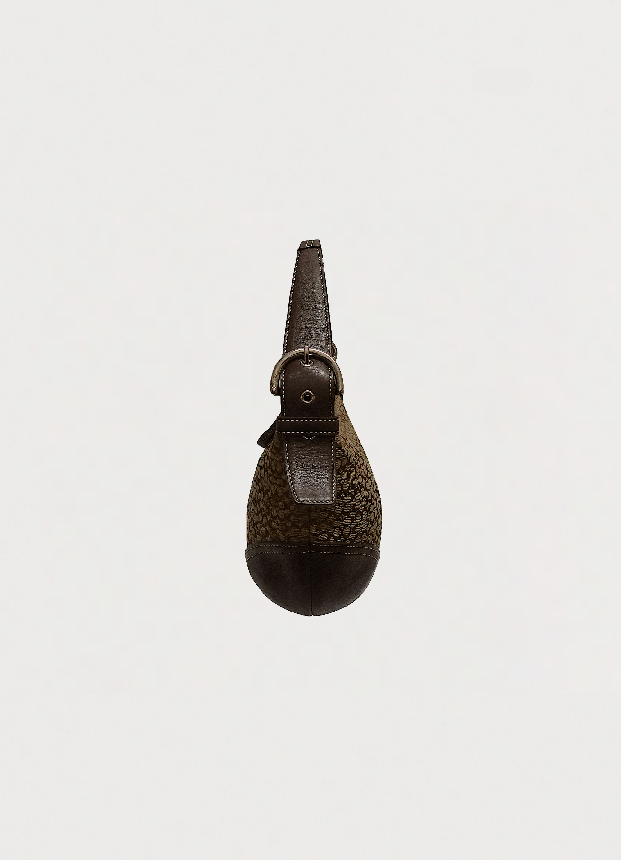 Right side profile of khaki Coach Soho hobo bag showing depth