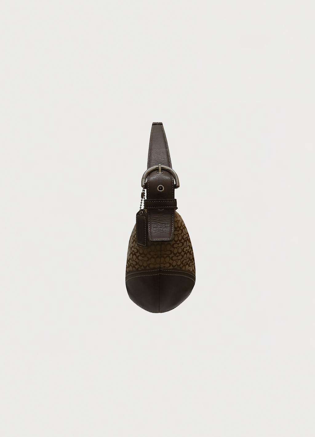 Left side profile of khaki Coach Soho hobo bag showing leather trim