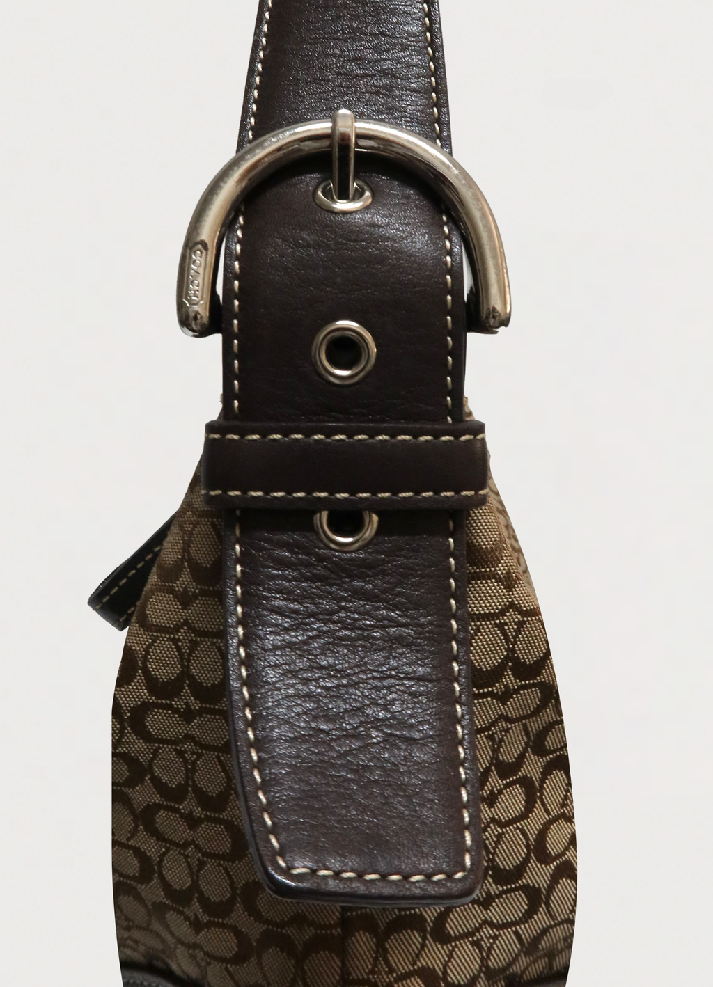 Close up of the adjustable leather shoulder strap and stitching on the Soho hobo