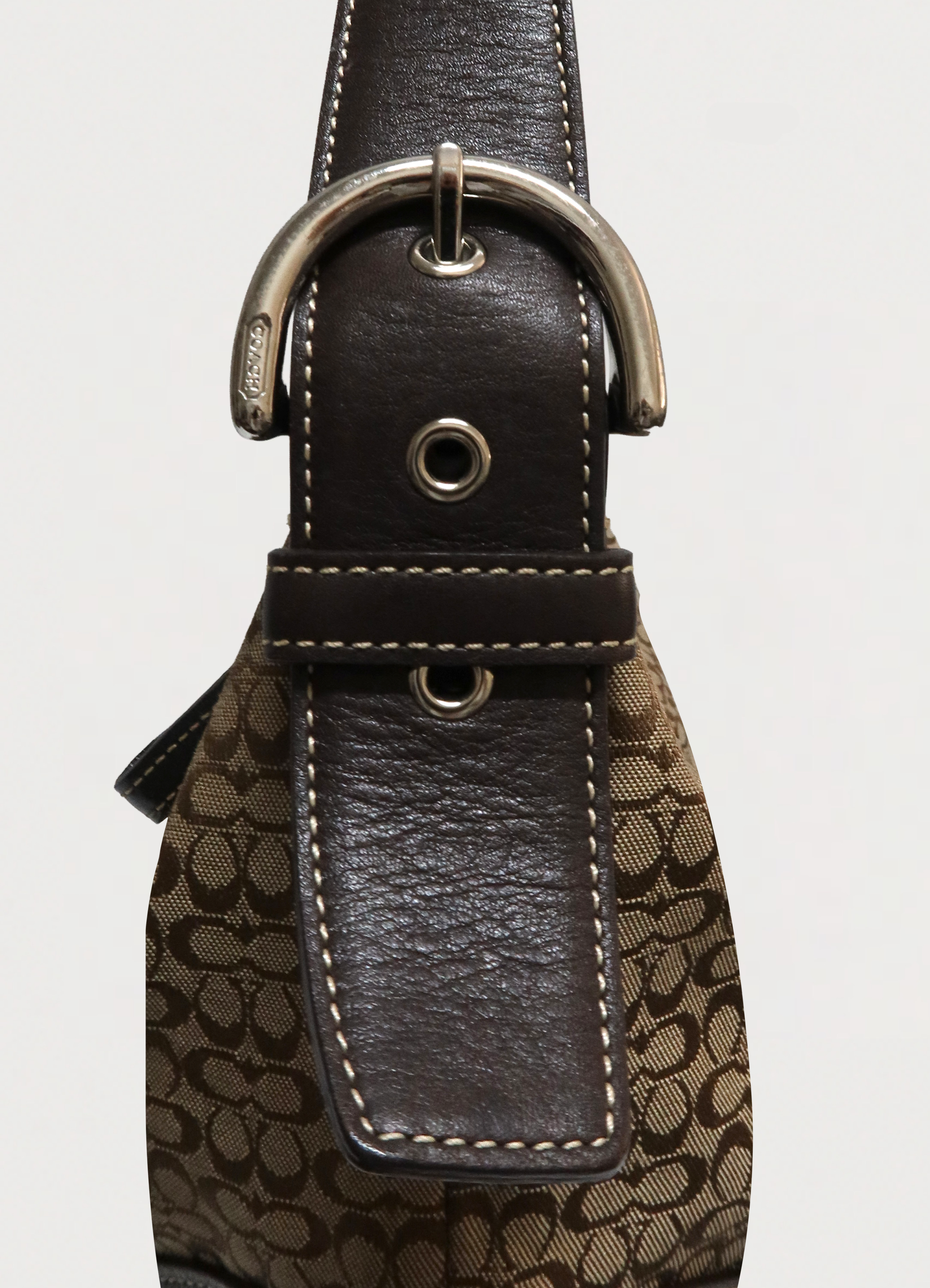 Close up of the adjustable leather shoulder strap and stitching on the Soho hobo