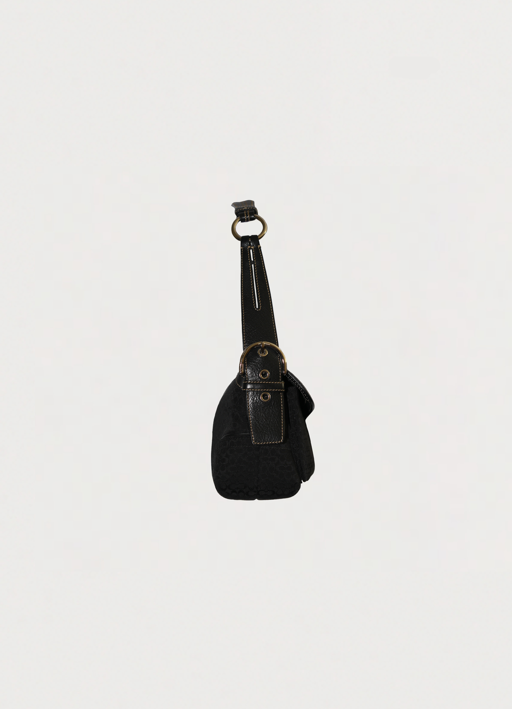 Right side profile of black Coach Soho monogram flap bag