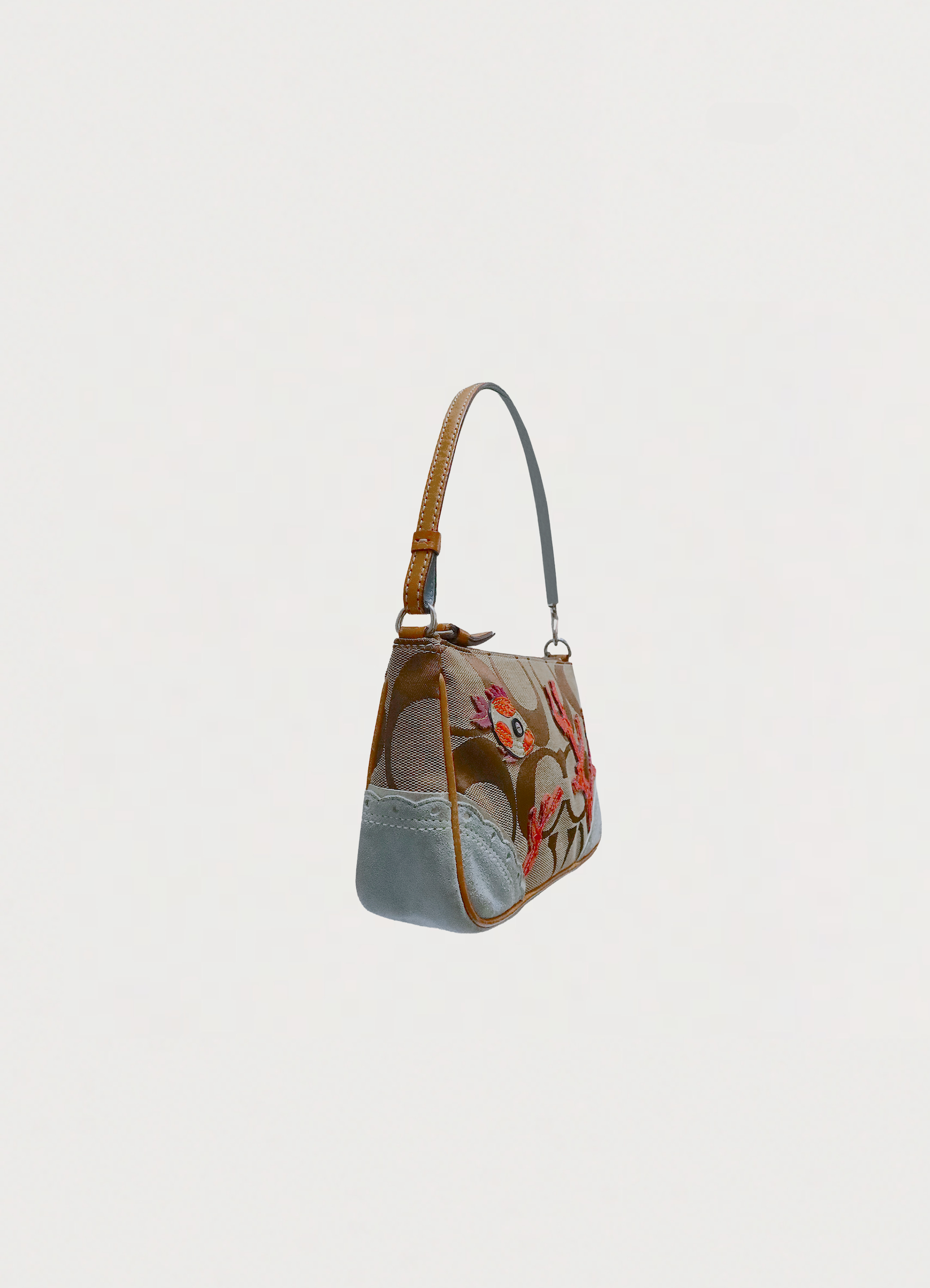 Vintage Coach Tropical Fish Demi bag in brown signature canvas with leather trim showing angled side