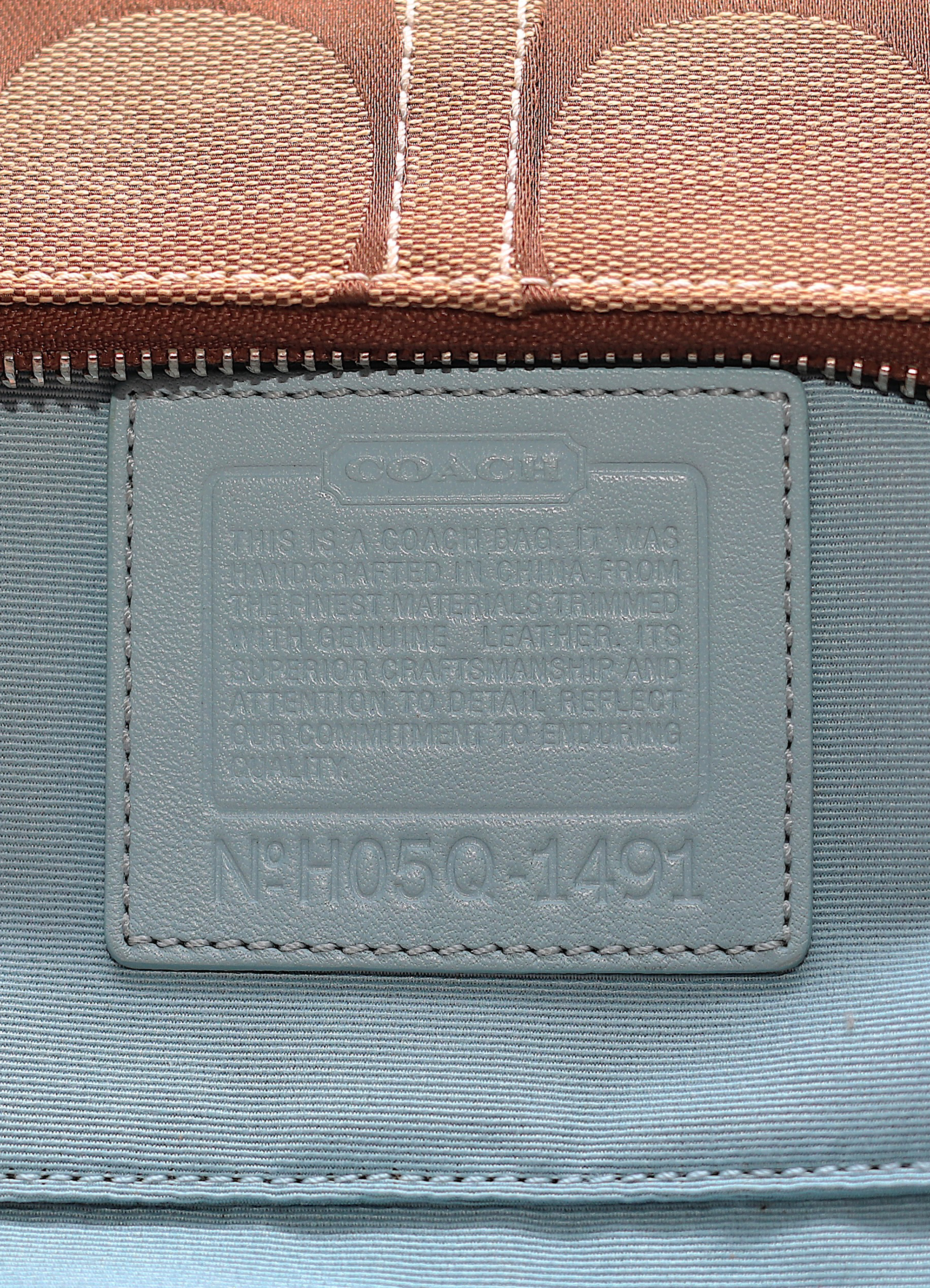 Vintage Coach Tropical Fish Demi bag in brown signature canvas with leather trim showing creed patch