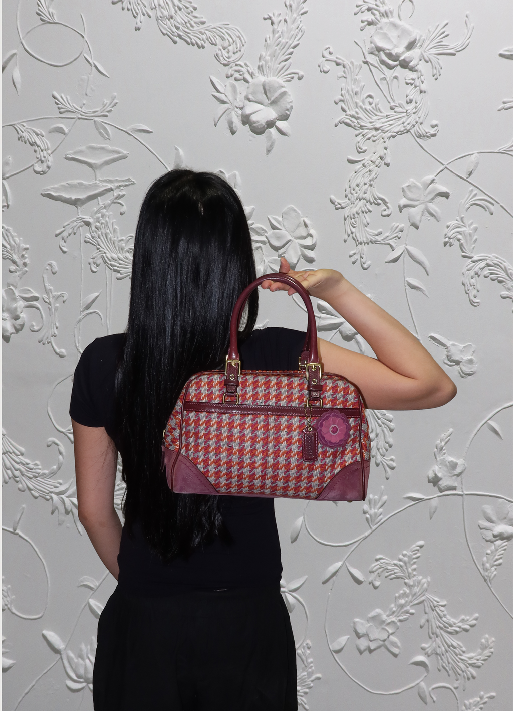 Coach Tweed Hadley satchel held by model